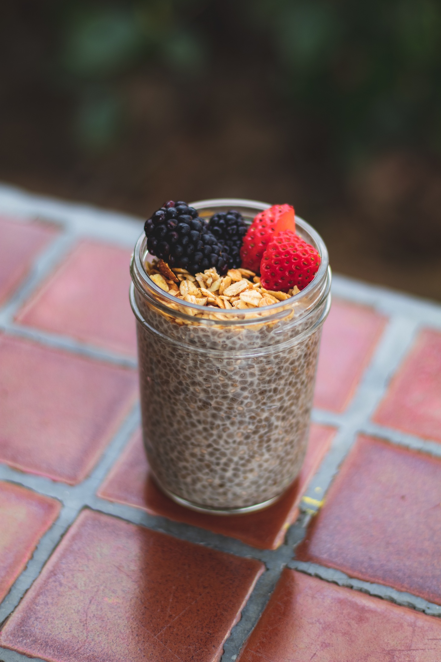 Chia pudding in a jar with granola on top.