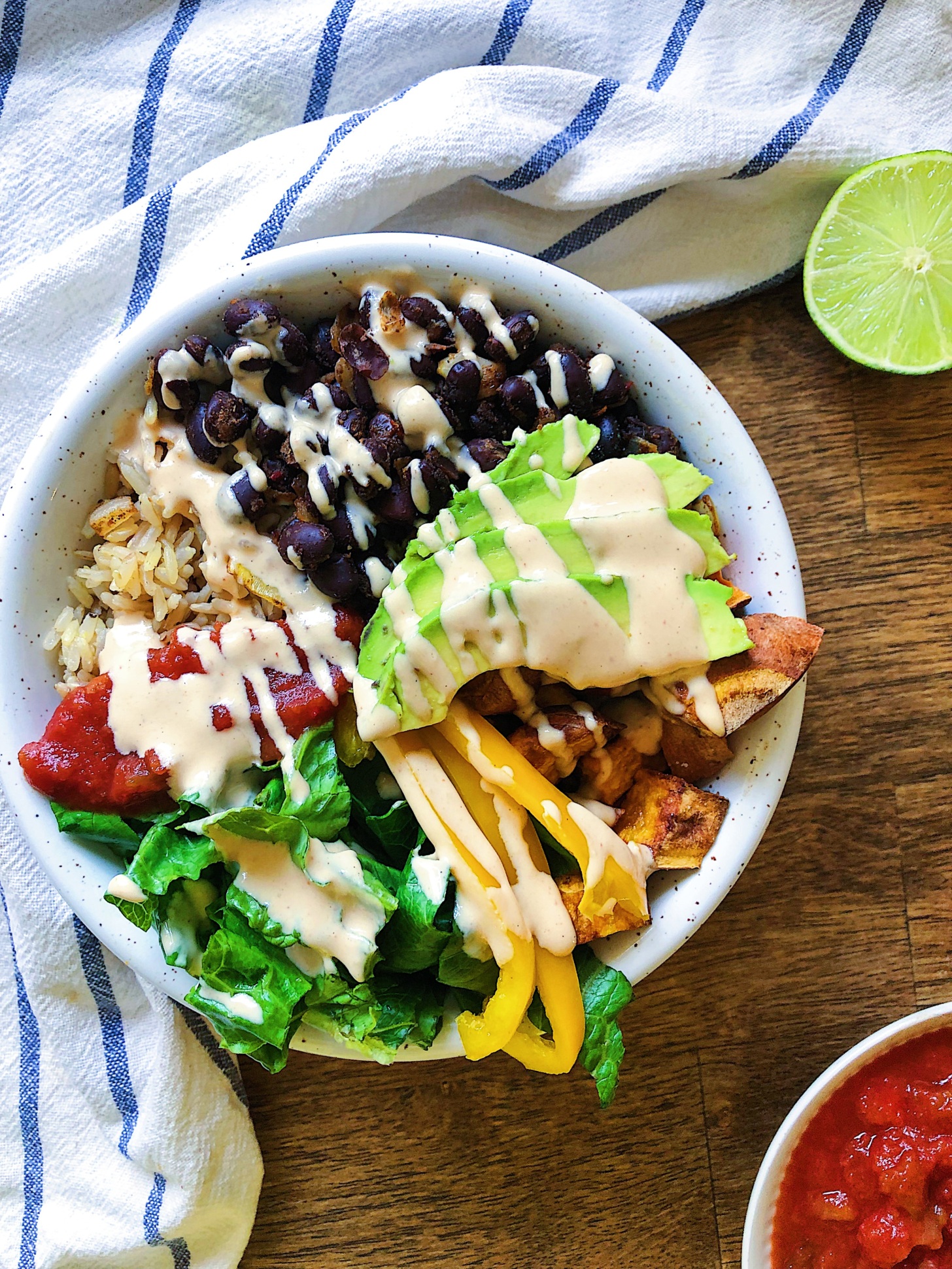 Vegan burrito bowl with spicy lime sauce
