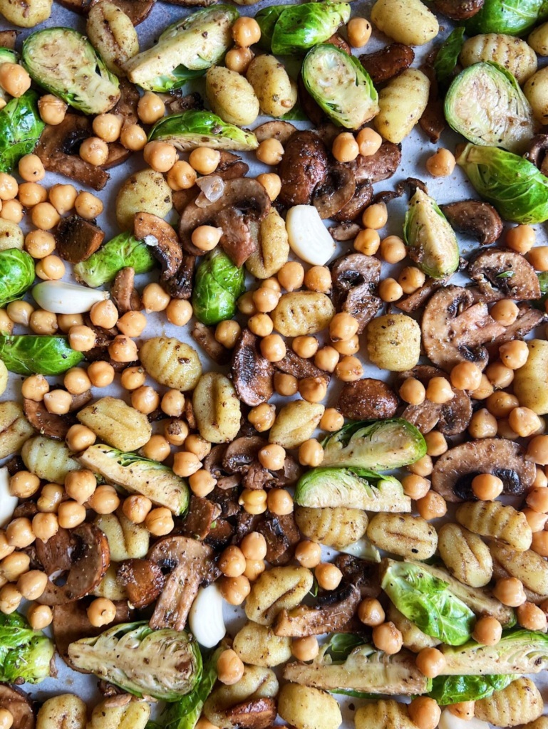 Chickpeas, brussel sprouts, and gnocchi and mushrooms on a sheet pan.