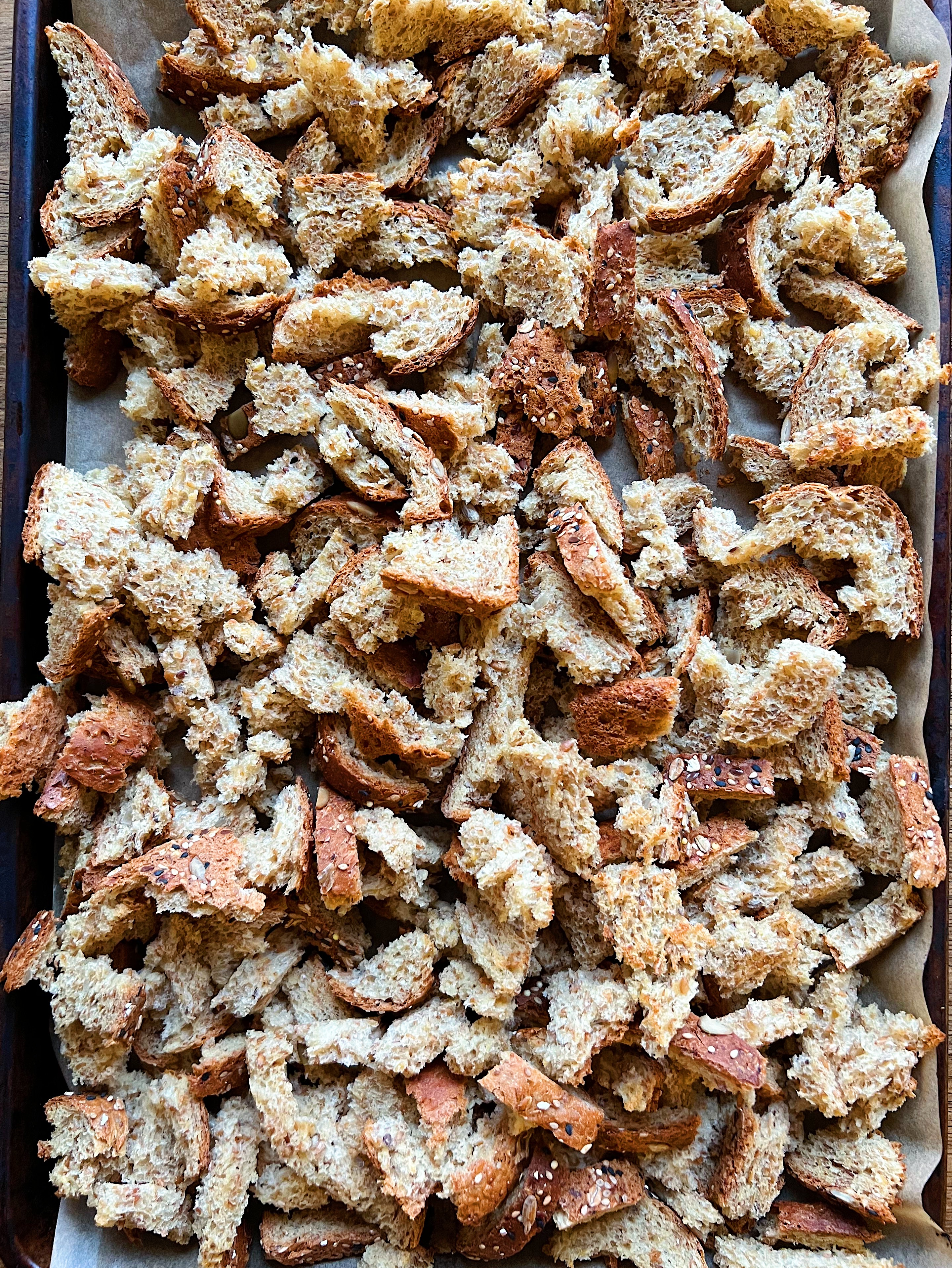 Bread on a sheet pan in small cubes. 