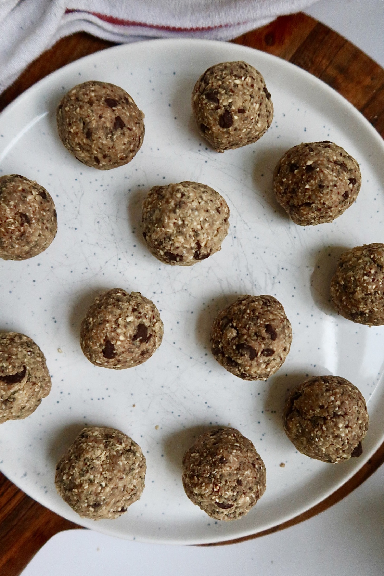 Overhead shot of cookie dough energy balls on a plate.