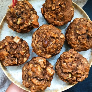 Plate with apple cinnamon walnut muffins on top