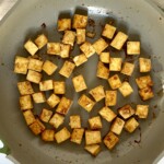 Teriyaki tofu cooking in a pan.