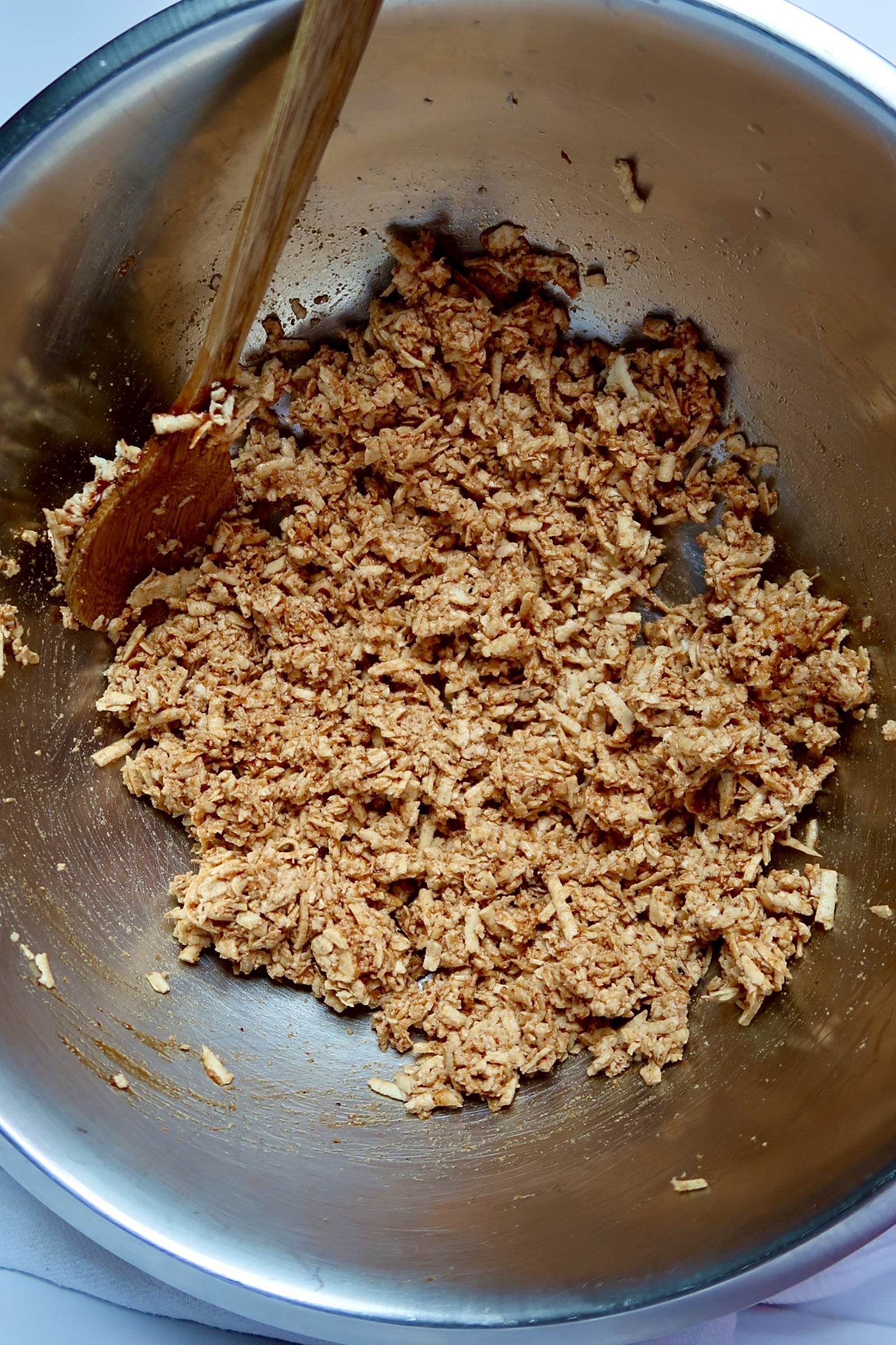 Shredded tofu in a bowl mixed with barbecue sauce.