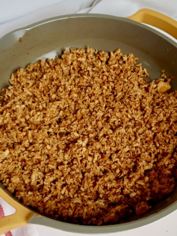Shredded tofu in a pan with barbecue sauce.