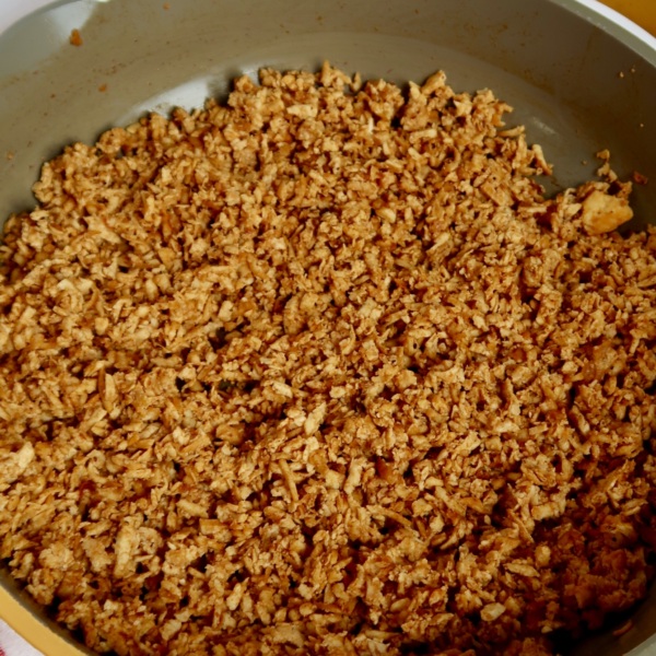 Shredded tofu in a pan with barbecue sauce.