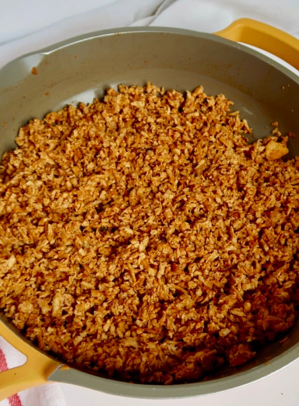 Shredded tofu in a pan with barbecue sauce.