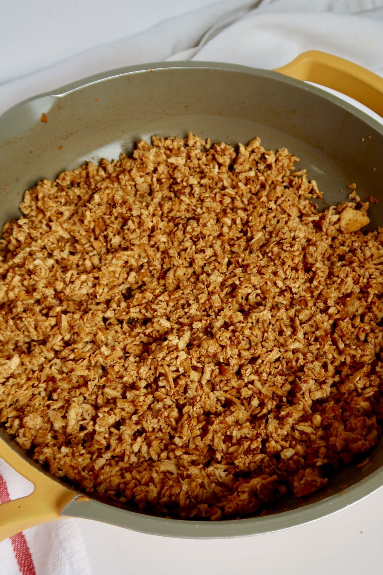 Shredded tofu in a pan with barbecue sauce.