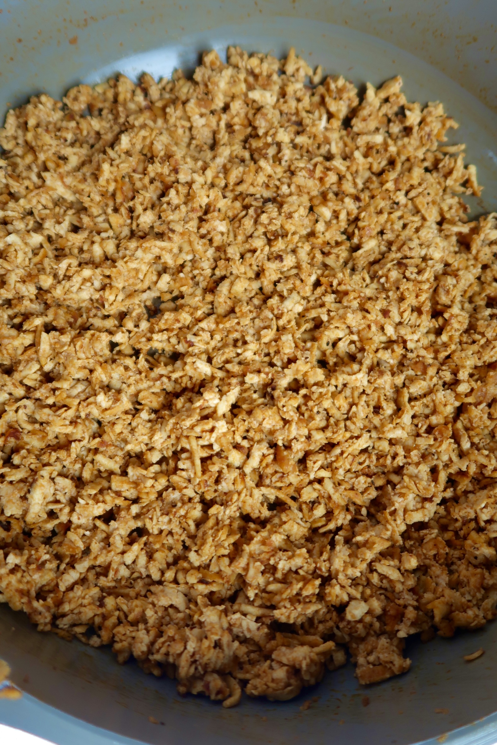 Shredded tofu in a pan with barbecue sauce.