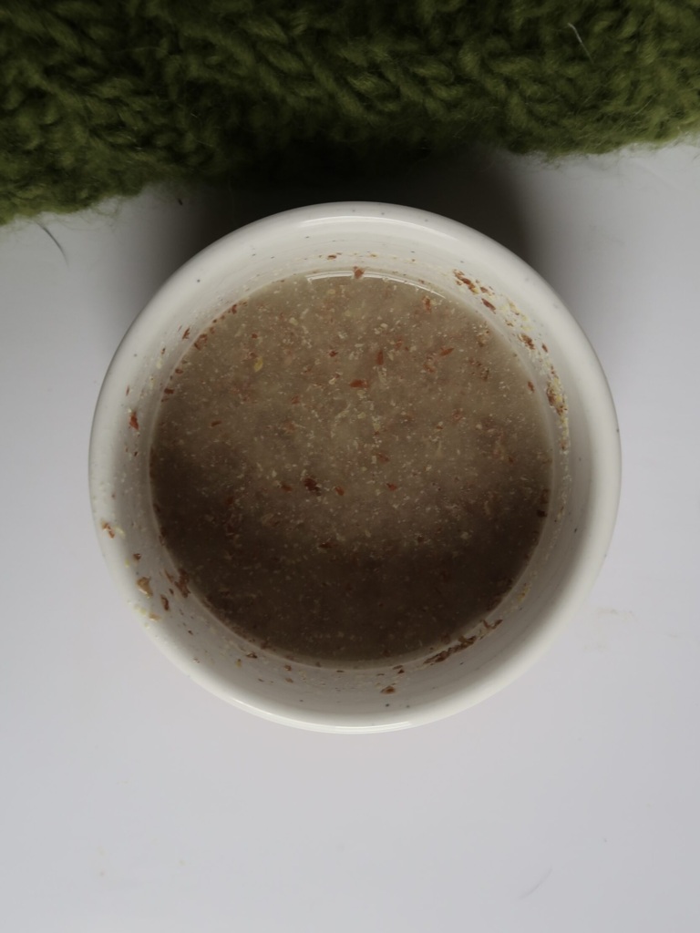 White bowl with ground flax and water inside