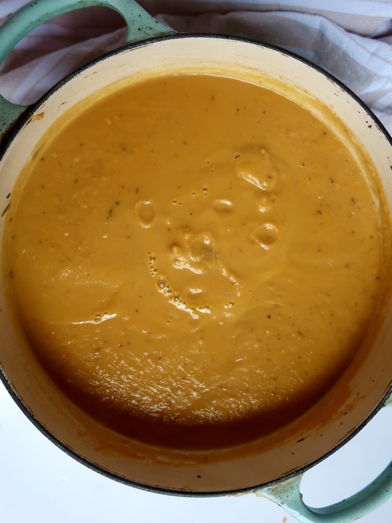 Blended sweet potato soup in a large pot.