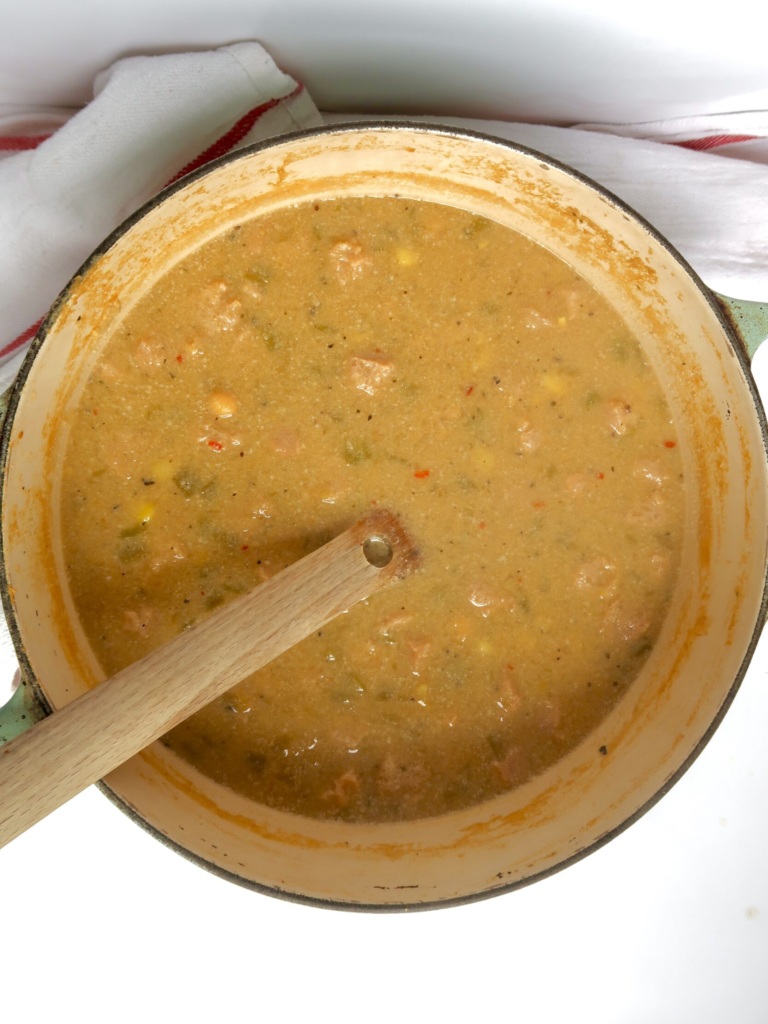 Large pot with creamy base with soy chunks.