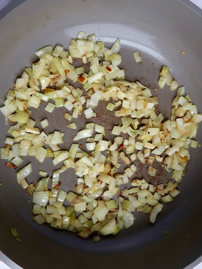 Sautéed onion and garlic in a pan