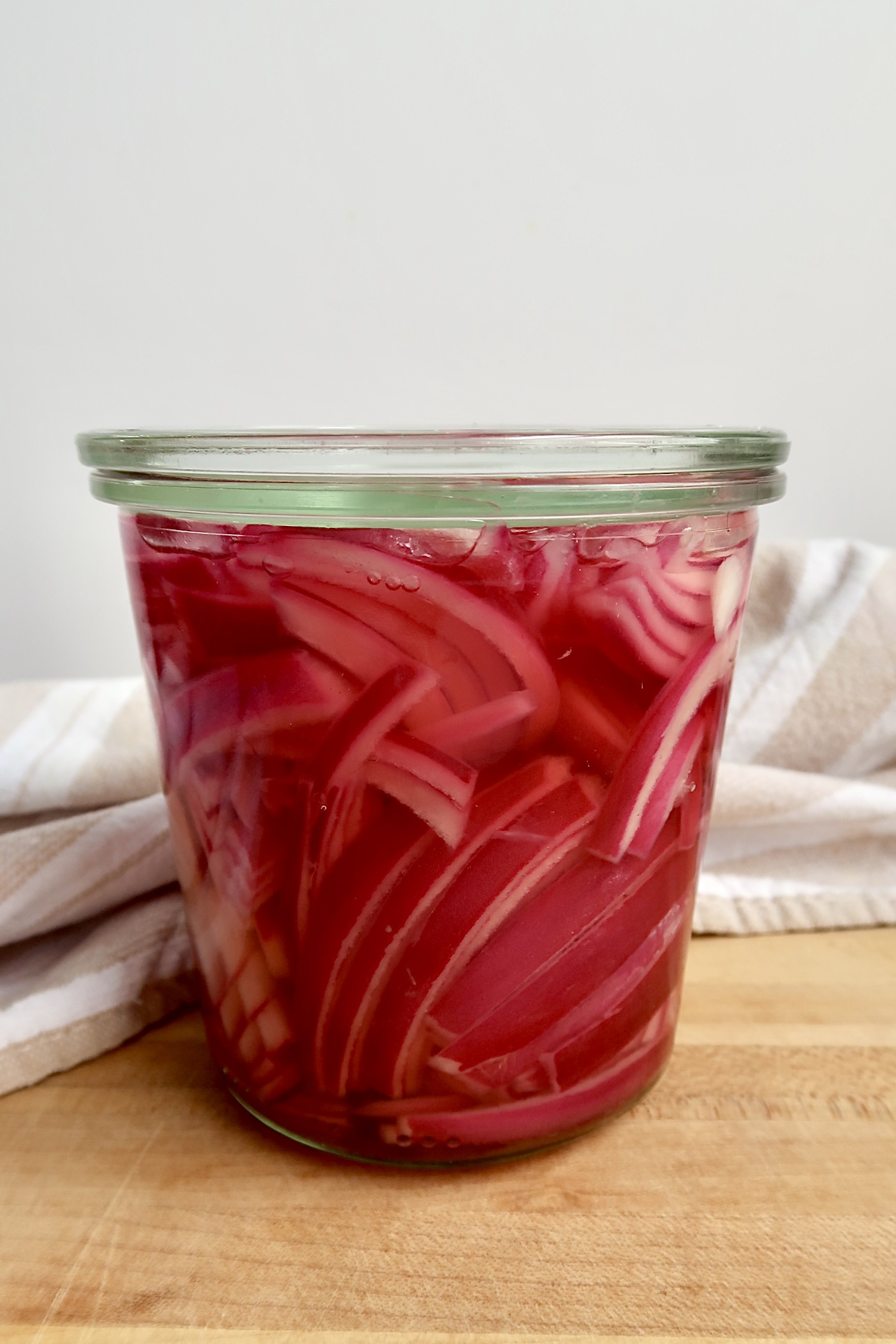 Jar with pickled red onion.