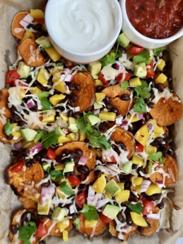 Sweet potato nachos with salsa and sour cream on the side.