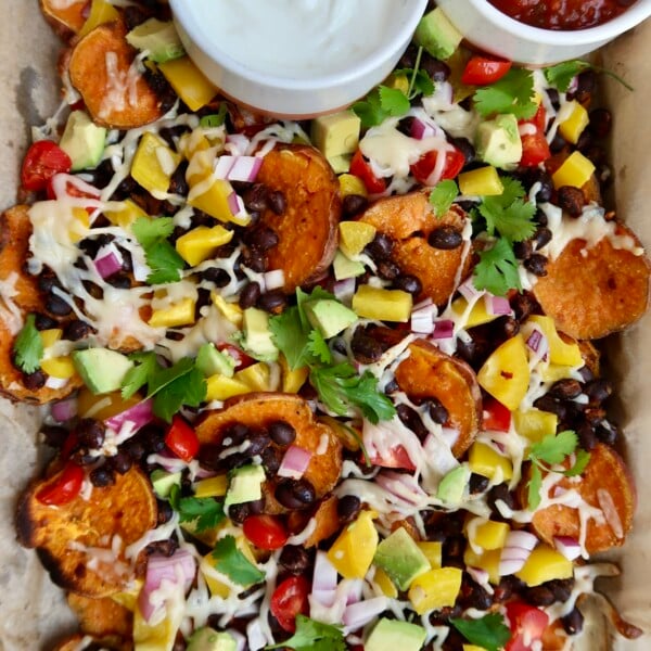 Sweet potato nachos with salsa and sour cream on the side.