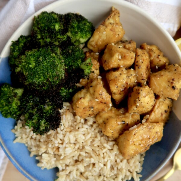 Bowl with lemon pepper tofu, rice and broccoli.