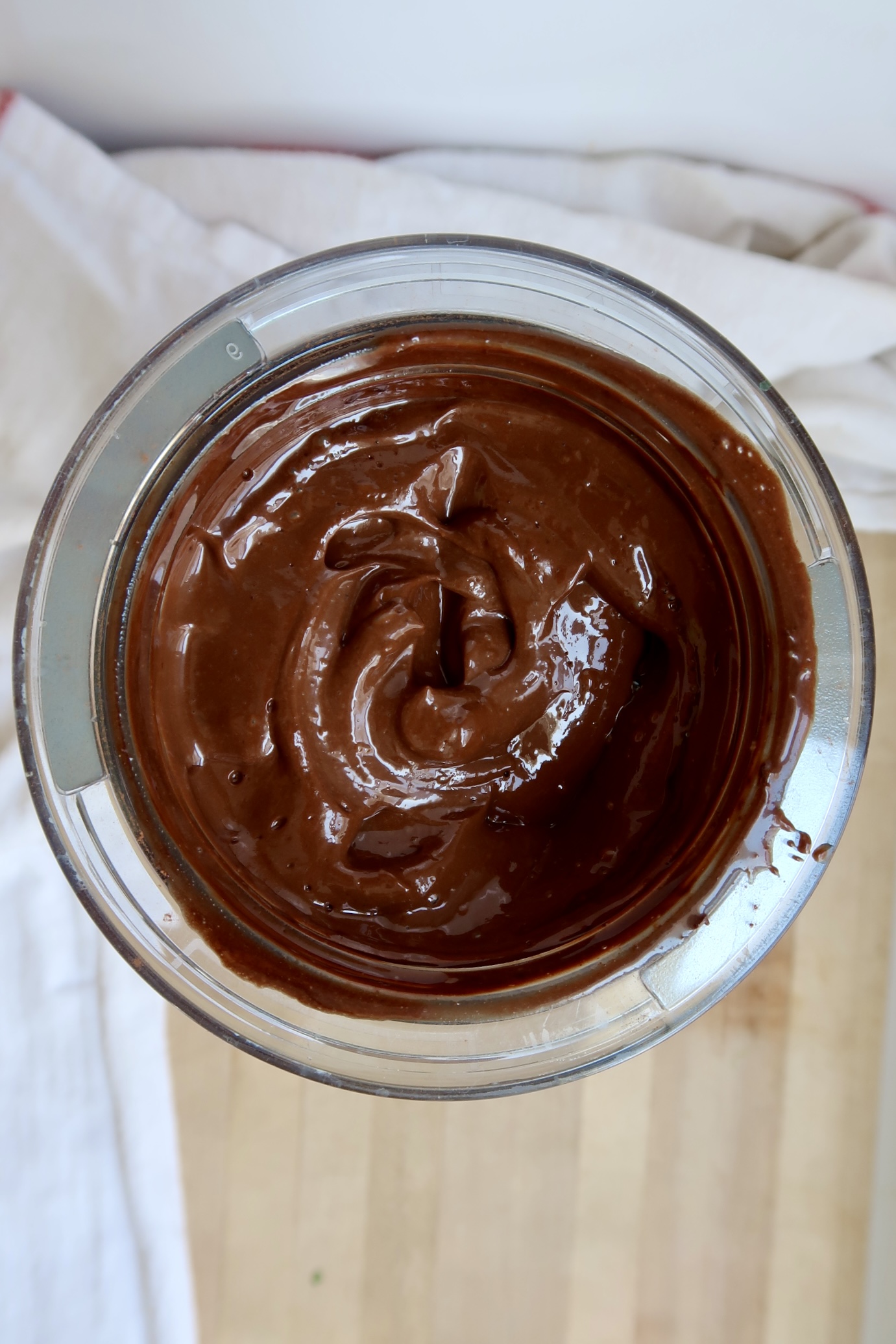 Overhead shot of blender container with blended chocolate chip mixture.