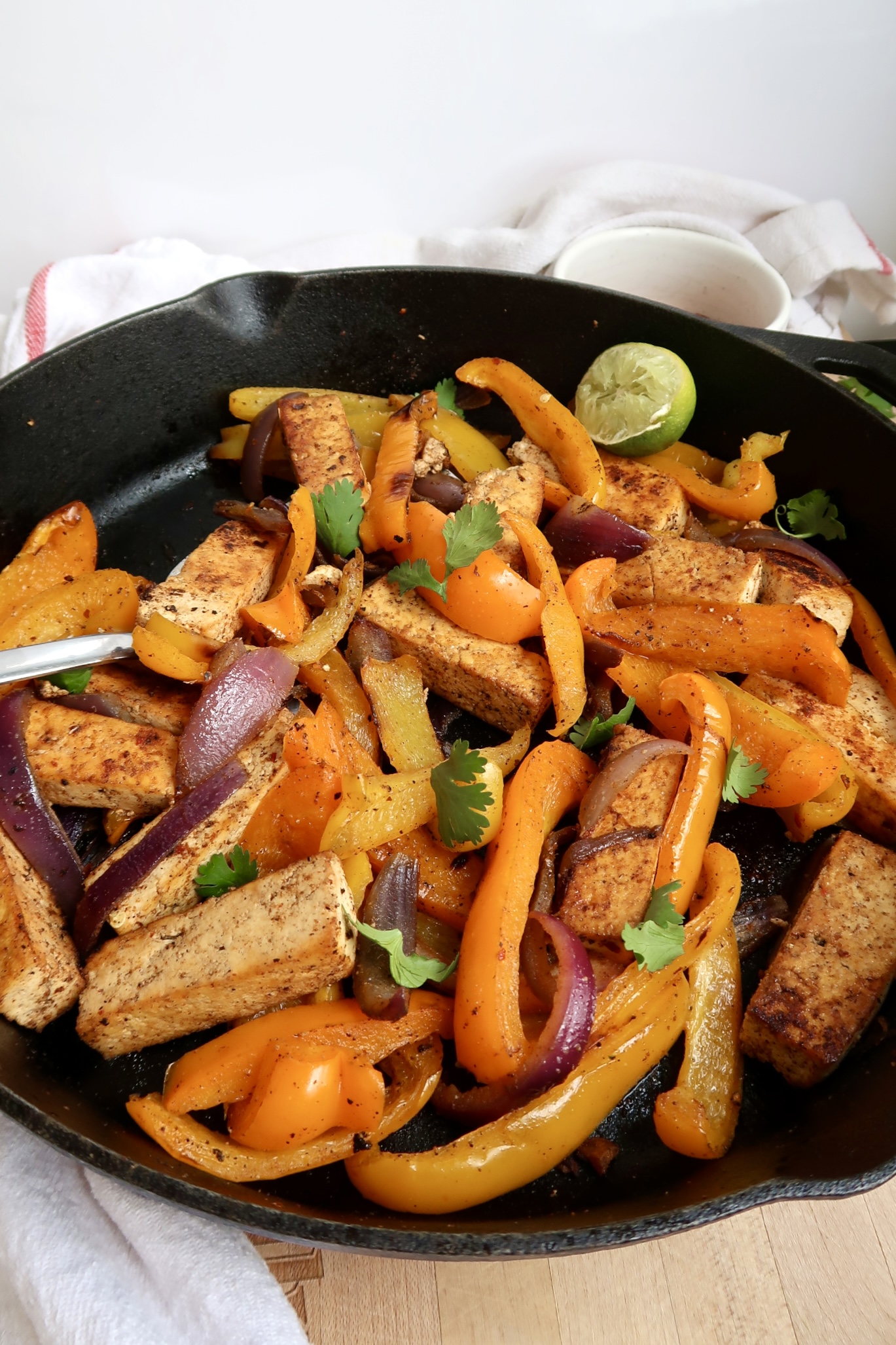 Pan of tofu fajita filling with peppers.