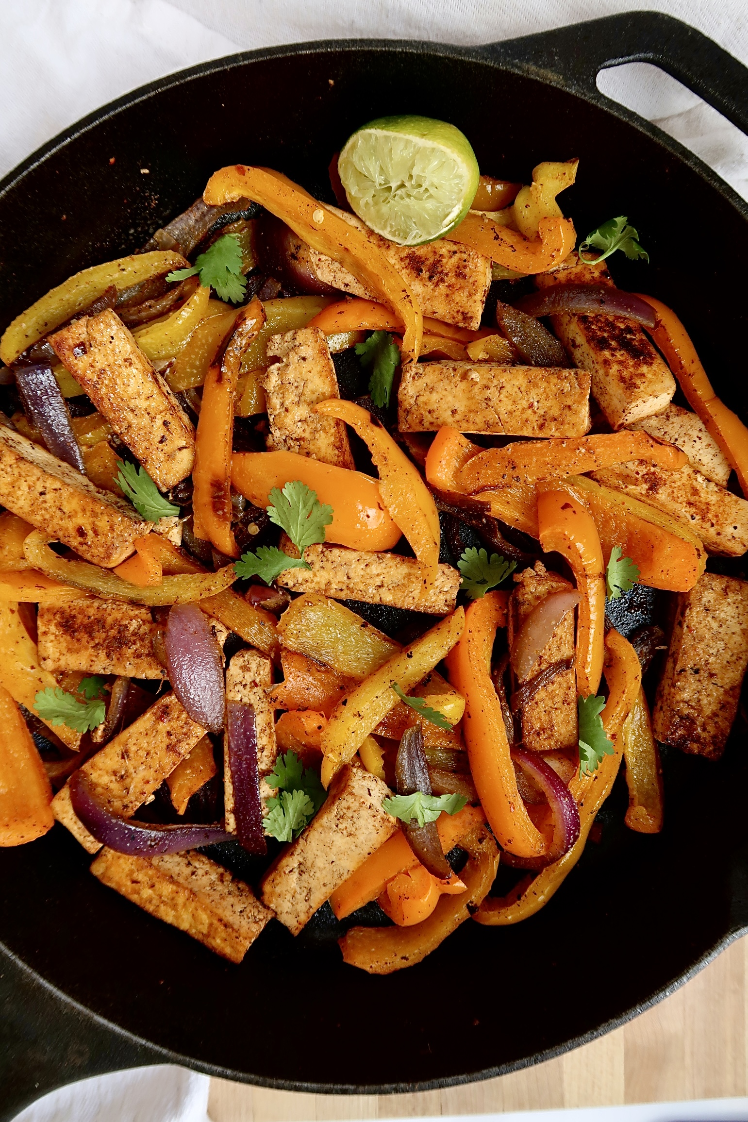 Pan of tofu fajita filling with peppers.