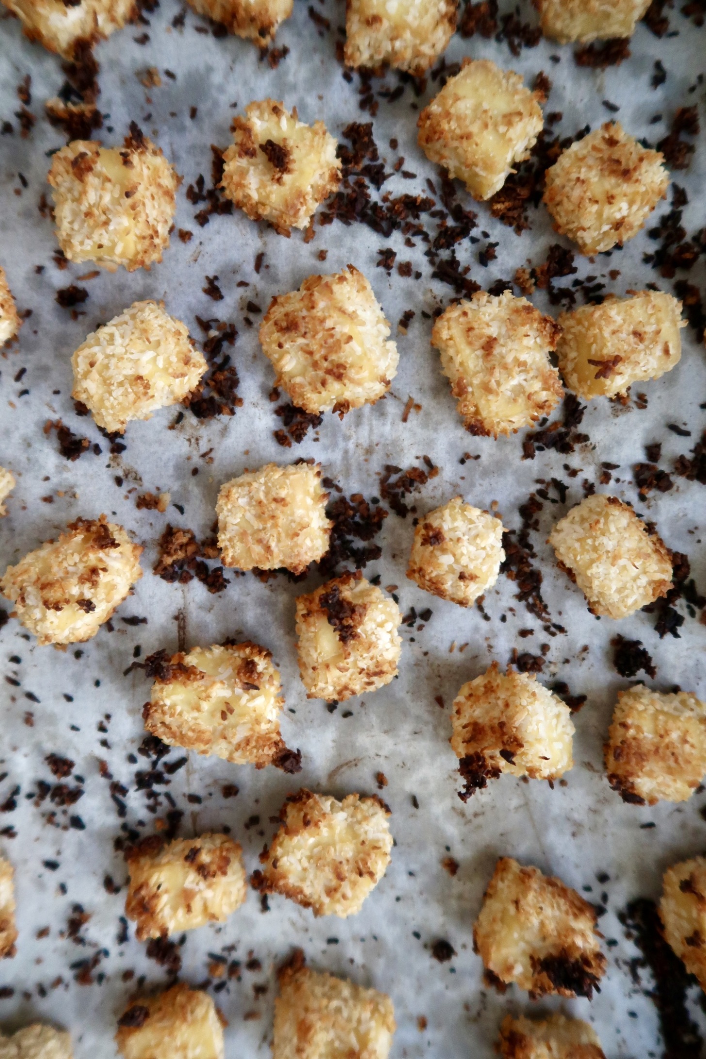 Sheet pan with baked coconut tofu on it.
