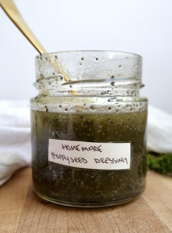 Poppyseed dressing in a jar that's labaled with a spoon in it.