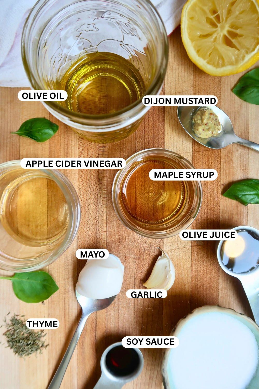 Flatlay of ingredients for herby salad dressing. 