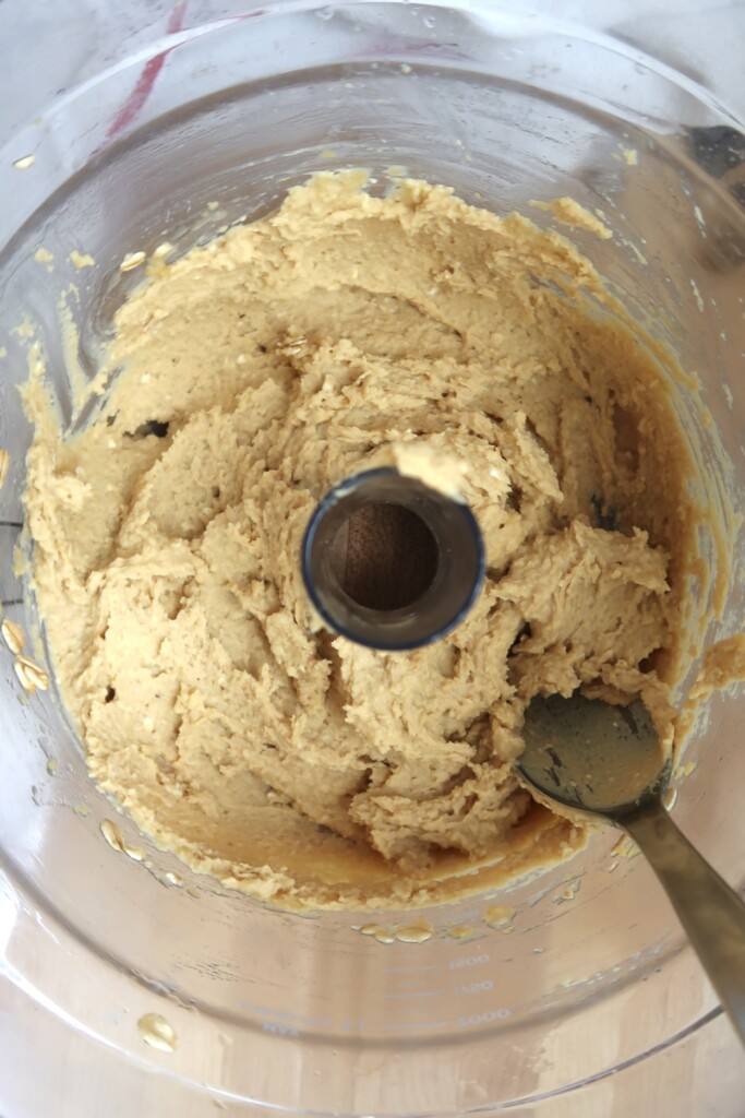 Food processor with blended chickpea cookie dough before adding chocolate chips.