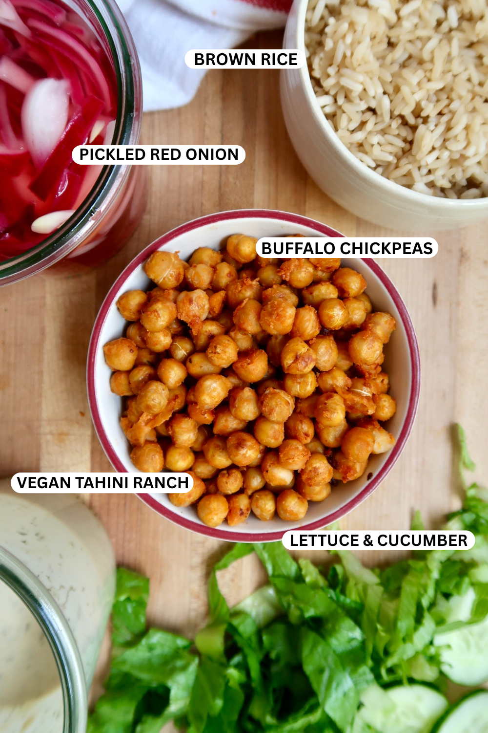 Buffalo chickpeas, quick pickled onion, brown rice and vegan ranch ingredient flatlay.