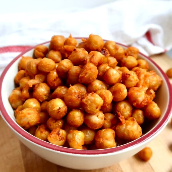 Bowl filled with golden, roasted buffalo chickpeas.