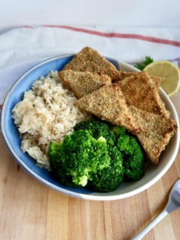 Bowl with breaded tofu, broccoli and rice.