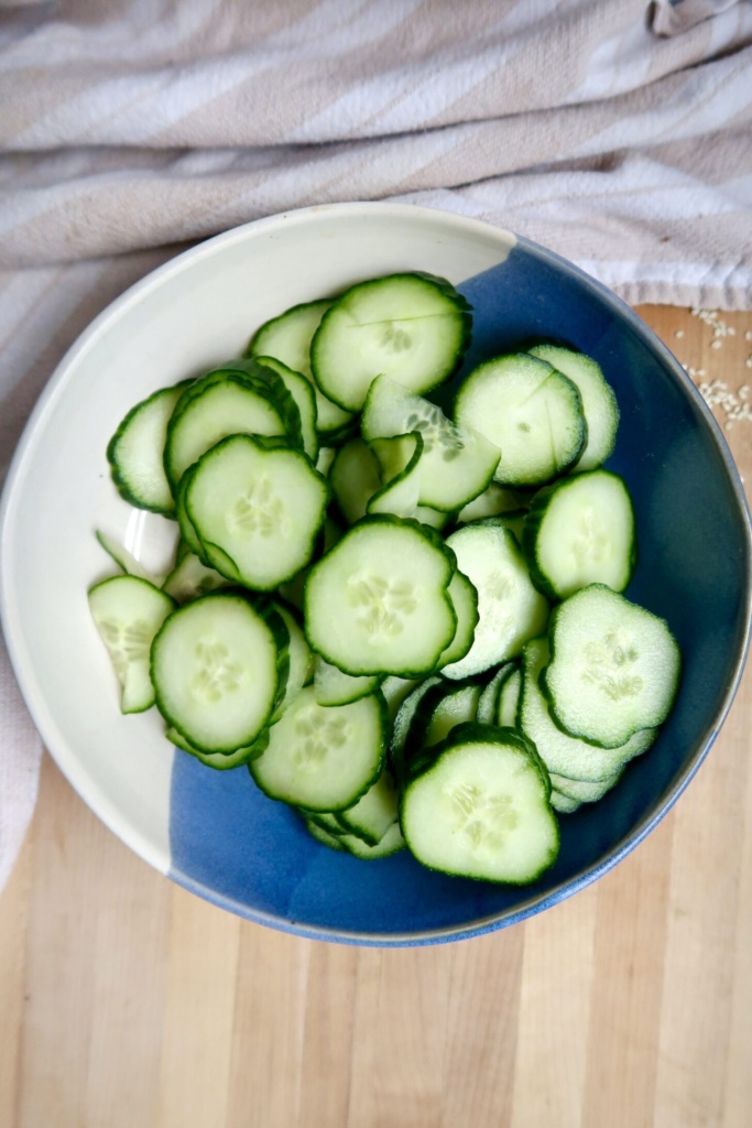 Blue and white bowl with sliced edamame.