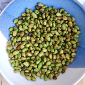 Bowl with roasted edamame inside.
