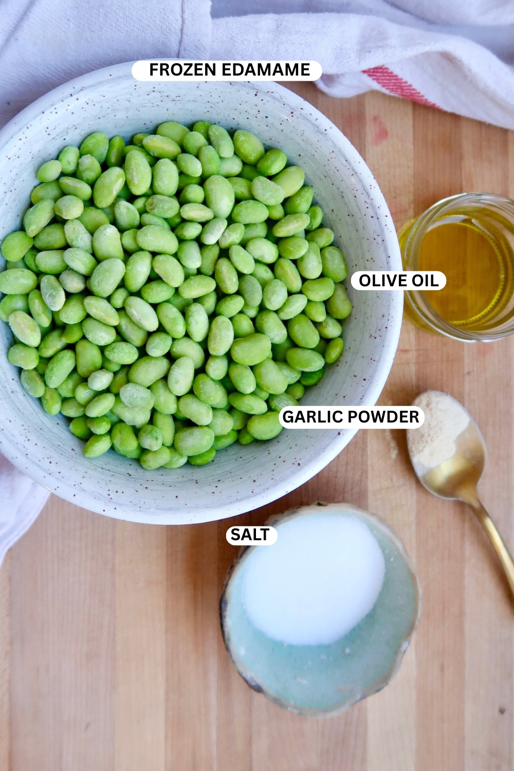 Flatlay of ingredients for roasted edamame snacks.